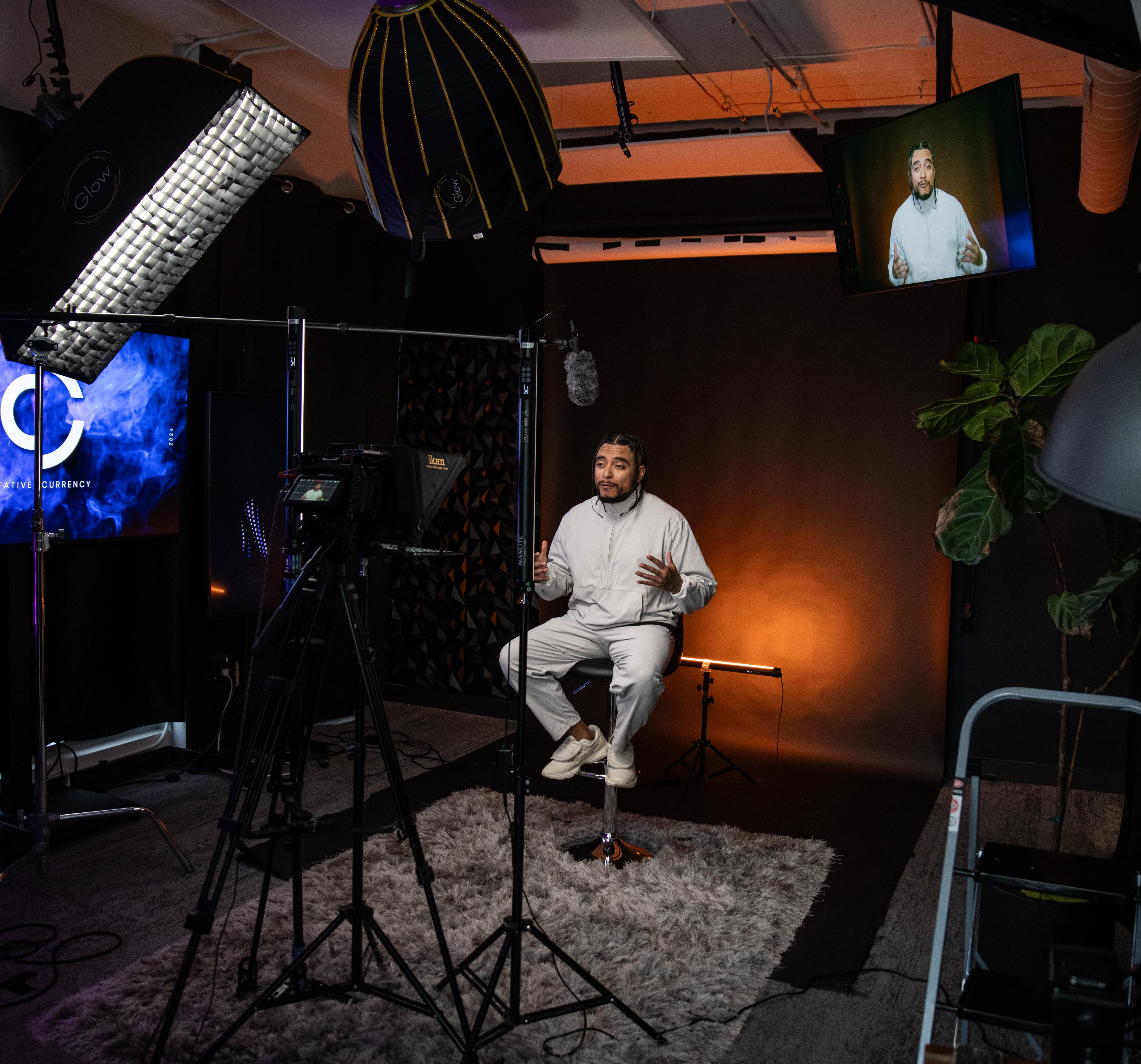 Presenter filming a video sales letter in a studio setup